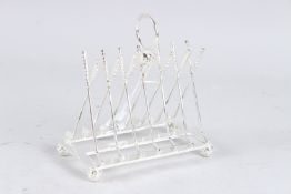 A SILVER PLATE GOLF TOAST RACK.
