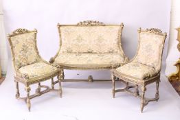 A FRENCH STYLE GILT FRAMED AND UPHOLSTERED THREE PIECE SUITE, comprising of a two seater sofa and
