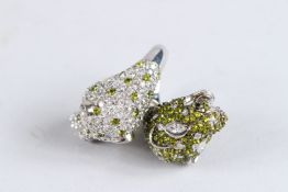 A SILVER DOUBLE HEADED LEOPARD RING. Ring size I.