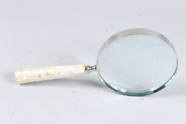 A LARGE MOTHER-OF-PEARL MAGNIFYING GLASS.