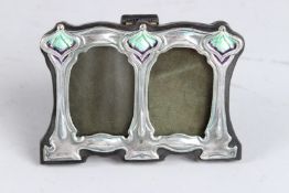 A SILVER MINIATURE DOUBLE PHOTOGRAPH FRAME. 3ins x 4ins.