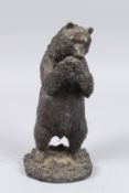 A STANDING BRONZE BEAR eating grapes. 10.5ins high.