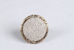 A SILVER DIAMANTE RING. Ring size N.