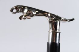 A JAGUAR WALKING STICK.