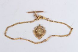 A 9CT GOLD CHAIN AND A 1907 CYCLING MEDAL.
