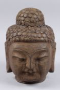 A STONE BUDDHA HEAD. 11ins high.