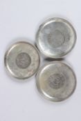 THREE CHINESE COIN DISHES. 3.5ins diameter.