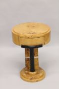 AN ART DECO DESIGN CIRCULAR TABLE with single drawer. 1ft 4ins diameter x 2ft 2ins high.