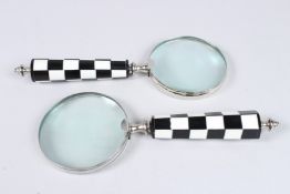TWO MAGNIFYING GLASSES with chequered handles.