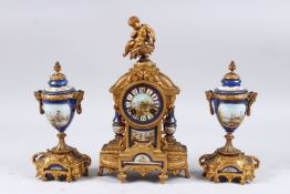 A GOOD 19TH CENTURY LOUIS XVITH GILT METAL AND PORCELAIN THREE-PIECE CLOCK GARNITURE with painted