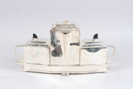 A SILVER PLATE DECO DESIGN TEAPOT SET.