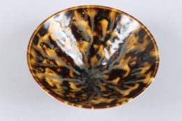 A CHINESE POTTERY BOWL with speckled decoration. 6ins diameter.