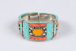 A CORAL AND TURQUOISE BANGLE.