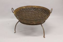 A LARGE IRON FIRE PIT. 2ft 8ins diameter.