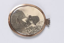 AN 18TH - 19TH CENTURY MINIATURE inset with a strand of hair and portrait, the frame with an earl'