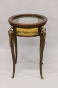 A GOOD LOUIS XVITH STYLE MAHOGANY CIRCULAR DISPLAY TABLE with gilt metal mounts.