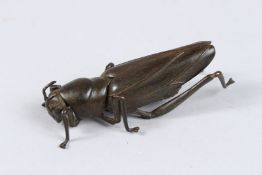 AN ARTICULATED JAPANESE BRONZE LOCUST. 3ins high.