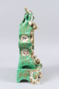 A 19TH CENTURY JACOB PETIT PORCELAIN MANTLE CLOCK AND STAND, green ground with gilt decoration and