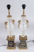 A GOOD PAIR OF REGENCY DESIGN CUT GLASS AND METAL LAMPS. 19ins high.