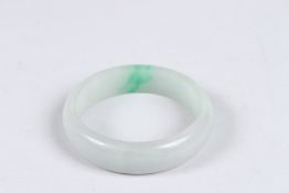 A PLAIN JADE BANGLE.