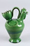 A SPANISH GREEN GLAZED CERAMIC PITCHER 1960's, initials CD. 10.5ins high.