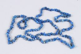 A LAPIS NECKLACE. 32ins long.