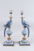 A GOOD PAIR OF BLUE AND WHITE BIRD CANDLESTICKS on square bases. 19ins high.