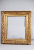 FINE GILTWOOD AND GESSO RECTANGULAR PICTURE FRAME with ornate floral and scroll decoration, rebate
