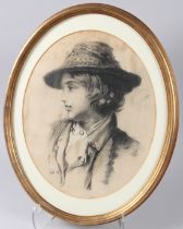 19TH CENTURY SCHOOL head and shoulder portrait of a youth, charcoal and chalk, oval mount and frame,