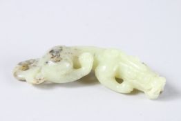 A CHINESE CARVED JADE BEAST. 4.5ins high.