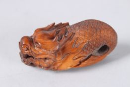 A CARVED WOOD DRAGON. 3ins.