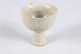 A CHINESE GE TYPE CRACKLE GLAZED HIGH STEM CUP. 8.8cms high.