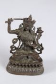 A SMALL CHINESE BRONZE SEATED DEITY. 3.5ins high.