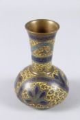 AN UNUSUAL 19TH CENTURY FRENCH CHAMPLEVE ENAMELLED BRASS VASE in the Kashmiri style. 5ins high.