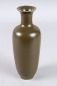 A CHINESE BROWN TAPERING VASE, six-character mark in blue. 8ins high.