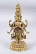 A GOOD CHINESE GILDED BRONZE FIGURE with six arms, on an oval base and inset with turquoise
