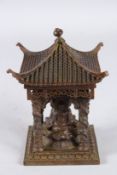 A CHINESE BRONZE SQUARE BUDDHA SHRINE. 5.5ins high.