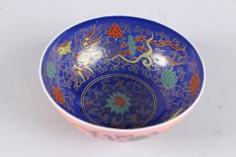 A CHINESE FAMILLE ROSE ENAMELLED DRAGON AND PHOENIX BOWL bearing six-character Chenhua mark. 12cms