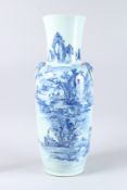 A LARGE 19TH CENTURY CHINESE BLUE AND WHITE VASE decorated with buildings, figures etc. 24ins