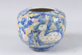 A 19TH CENTURY PERSIAN QAJAR GLAZED POTTERY VASE. Signed.