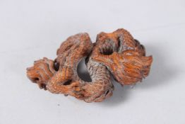 A CARVED WOOD DRAGON. 3ins.