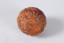 A CARVED WOOD BALL. 1.75ins.
