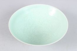 A CHINESE INCISED CIRCULAR SHALLOW BOWL. 8ins diameter.