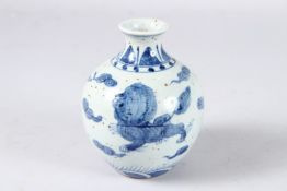 A CHINESE BLUE AND WHITE LION DOGS VASE, bears four-character mark. 12cms.
