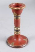 A TURKISH TOPANE TERRACOTTA CIRCULAR CANDLESTICK. 7ins high.