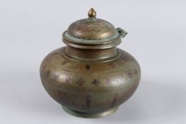 A FINE 19TH CENTURY SOUTH INDIAN TANJORE COPPER INLAID BRASS LIDDED LOTUS VESSEL. 5.5ins long.