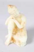 A SMALL CHINESE CARVED WHiTE JADE FIGURE. 5ins high.