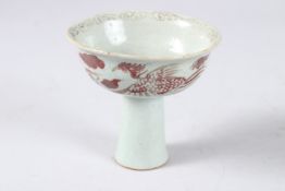 A CHINESE YUAN STLE UNDERGLAZED RED PHOENIX HIGH STAND CUP. 9cms high.