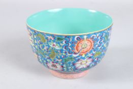 A CHINESE BLUE ENAMEL CIRCULAR BOWL with flowers in many colours. Square mark. 5.25ins diameter x