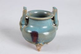A CHINESE JUNS TYLE TWIN HANDLED CENSER, 10cms high.